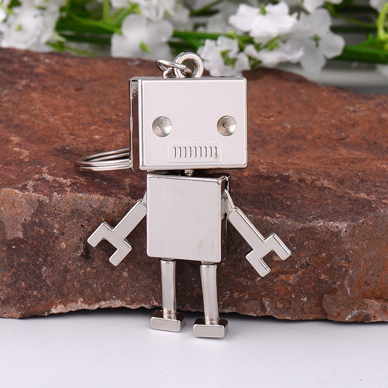 Porte-clés petit robot articulé argenté Porte-clés petit robot articulé argenté