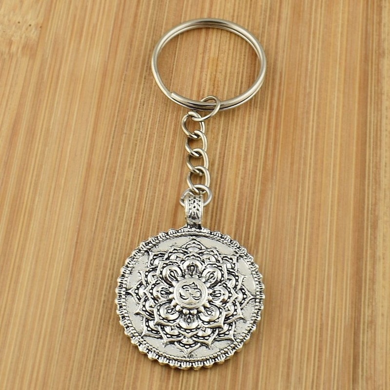Porte-clés fleur de vie feuille de lotus symbole Om argenté