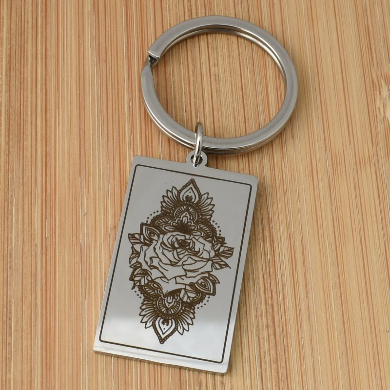 Porte-clés fleur de lotus dans un rectangle acier inoxydable Porte-clés fleur de lotus dans un rectangle acier inoxydable