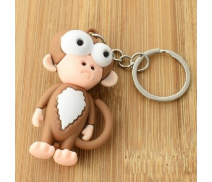Porte-clés singe rigolo marron et blanc en 3D