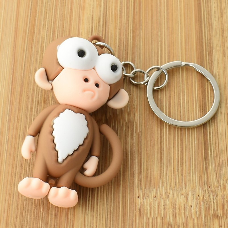 Porte-clés singe rigolo marron et blanc en 3D