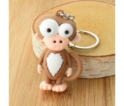 Porte-clés singe rigolo marron et blanc en 3D