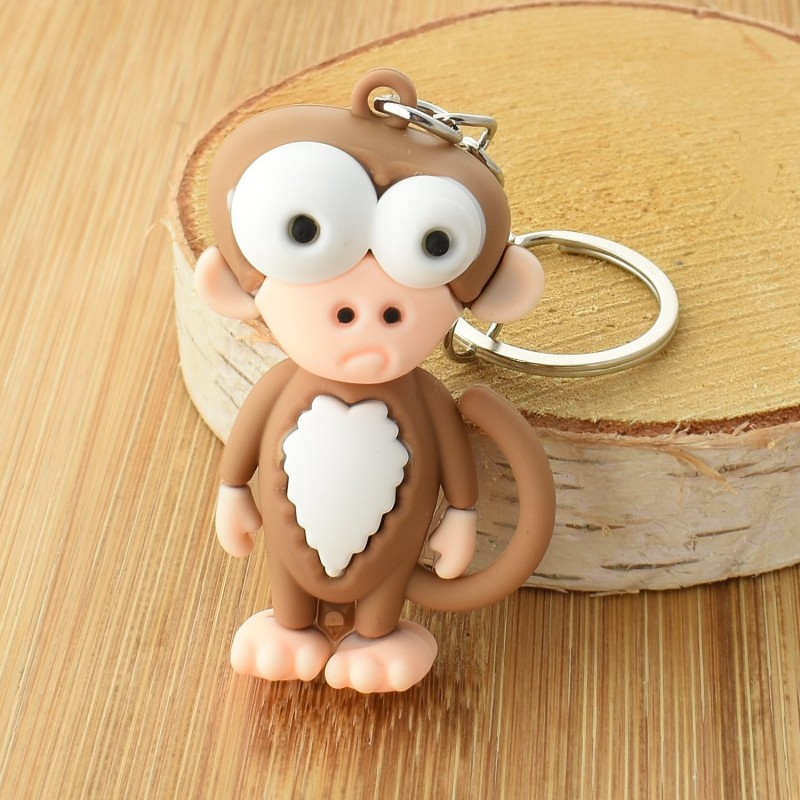 Porte-clés singe rigolo marron et blanc en 3D