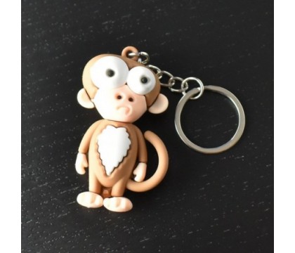 Porte-clés singe rigolo marron et blanc en 3D