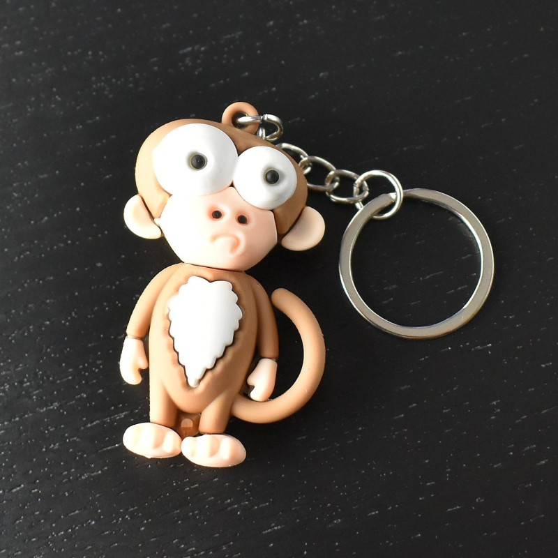 Porte-clés singe rigolo marron et blanc en 3D