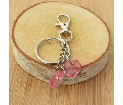 Porte-clés bijou de sac argenté 2 coeurs roses à facettes
