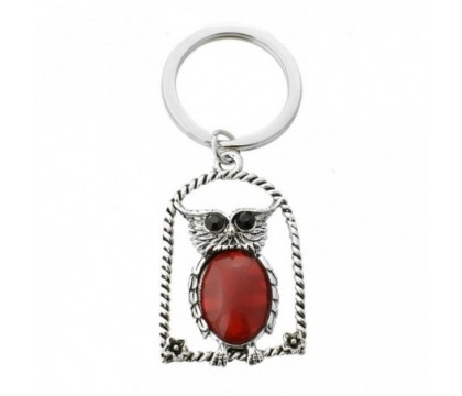 Porte-clés hibou rouge sur son perchoir avec fleurs yeux strass argenté