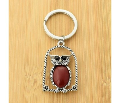 Porte-clés hibou rouge sur son perchoir avec fleurs yeux strass argenté