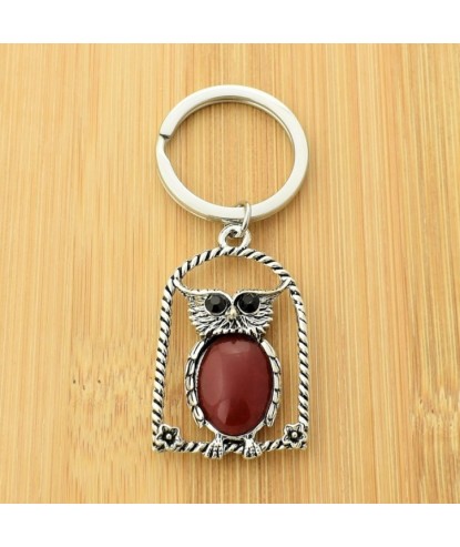 Porte-clés hibou rouge sur son perchoir avec fleurs yeux strass argenté