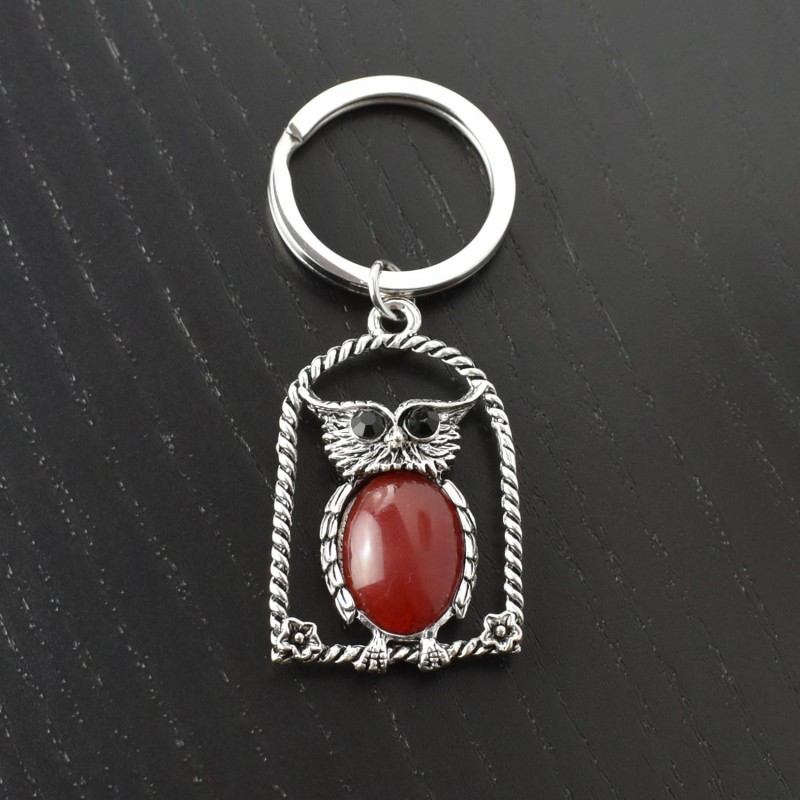 Porte-clés hibou rouge sur son perchoir avec fleurs yeux strass argenté