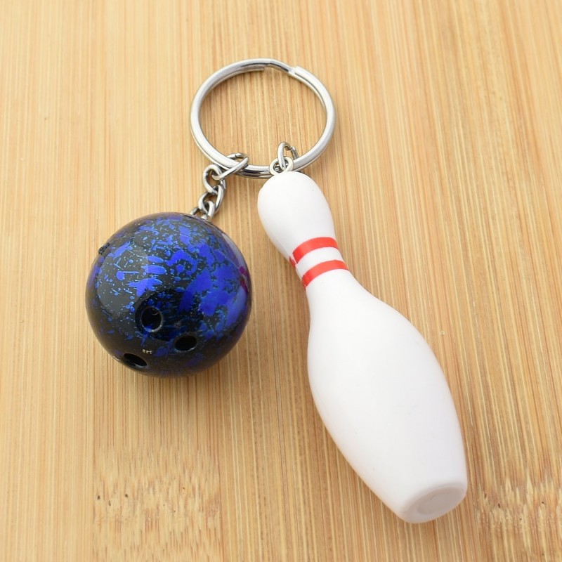 Porte-clés quille blanche et rouge, boule de bowling aux reflets bleutés argenté Porte-clés quille blanche et rouge, boule de bowling aux reflets bleutés argenté