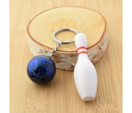 Porte-clés quille blanche et rouge, boule de bowling aux reflets bleutés argenté Porte-clés quille blanche et rouge, boule de bowling aux reflets bleutés argenté