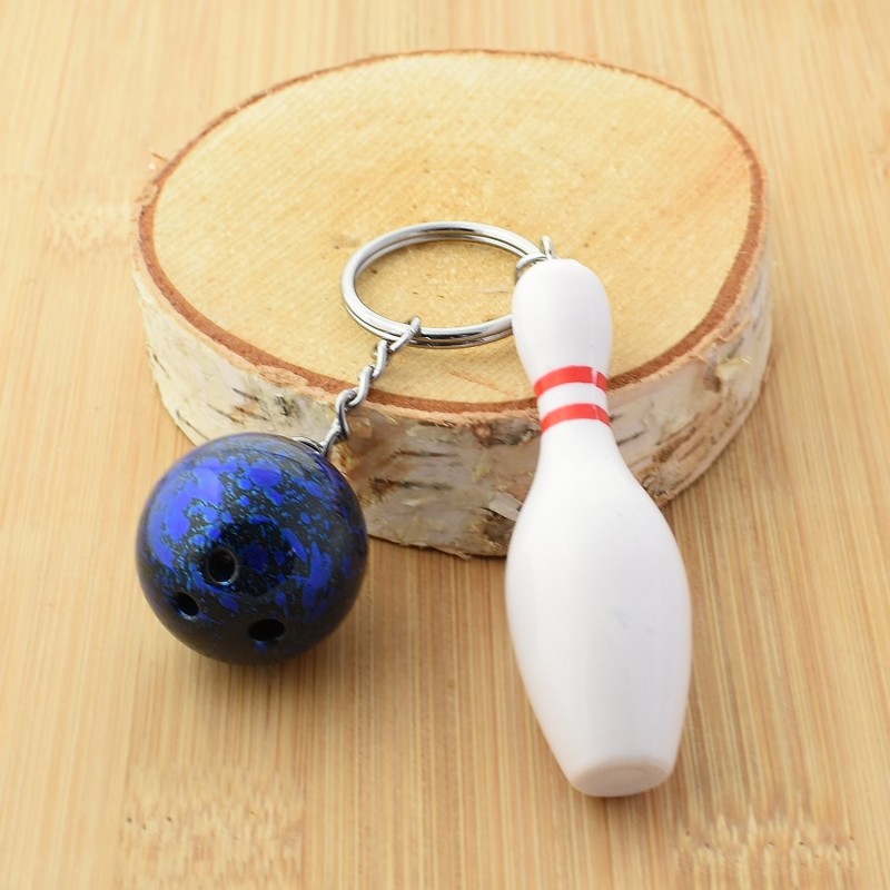 Porte-clés quille blanche et rouge, boule de bowling aux reflets bleutés argenté Porte-clés quille blanche et rouge, boule de bowling aux reflets bleutés argenté