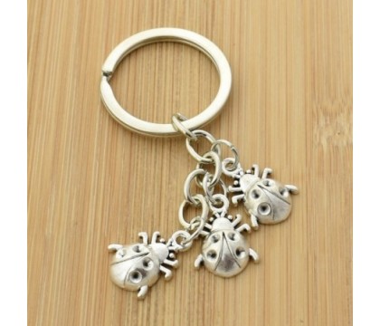 Porte-clés coccinelle 3 pendentifs porte-bonheur argenté