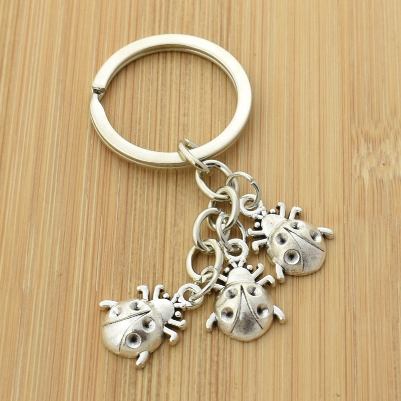 Porte-clés coccinelle 3 pendentifs porte-bonheur argenté