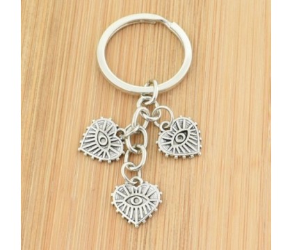 Porte-clés 3 pendentifs oeil dans un coeur argenté