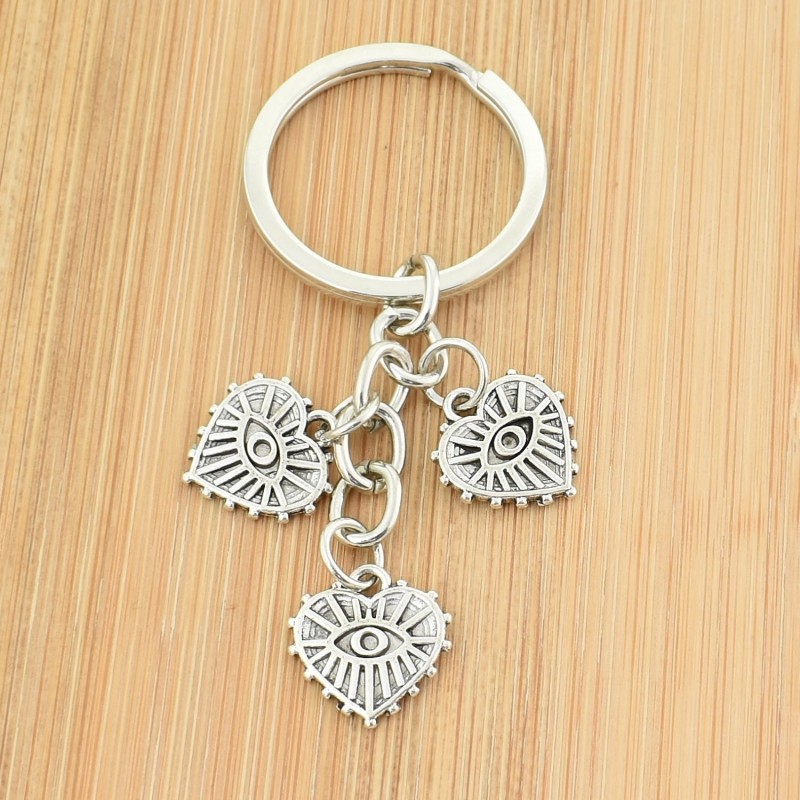 Porte-clés 3 pendentifs oeil dans un coeur argenté