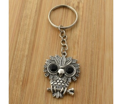 Porte-clés hibou aux grands yeux ronds et noirs argenté