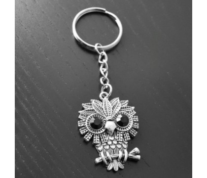 Porte-clés hibou aux grands yeux ronds et noirs argenté