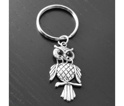 Porte-clés hibou yeux noirs articulé argenté